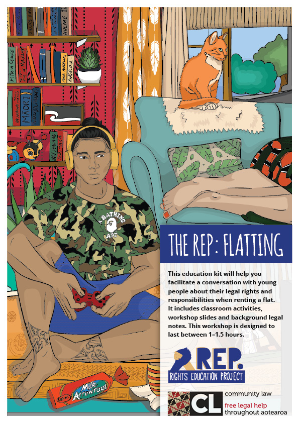 Young man sitting on floor playing playstation. Cat sitting on couch.